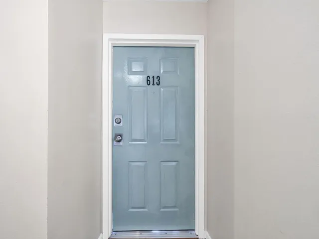 a view of a bathroom from a hallway