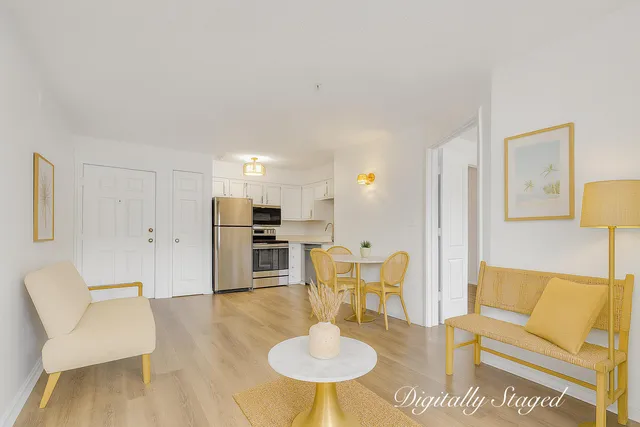 a living room with furniture a dining table and kitchen view