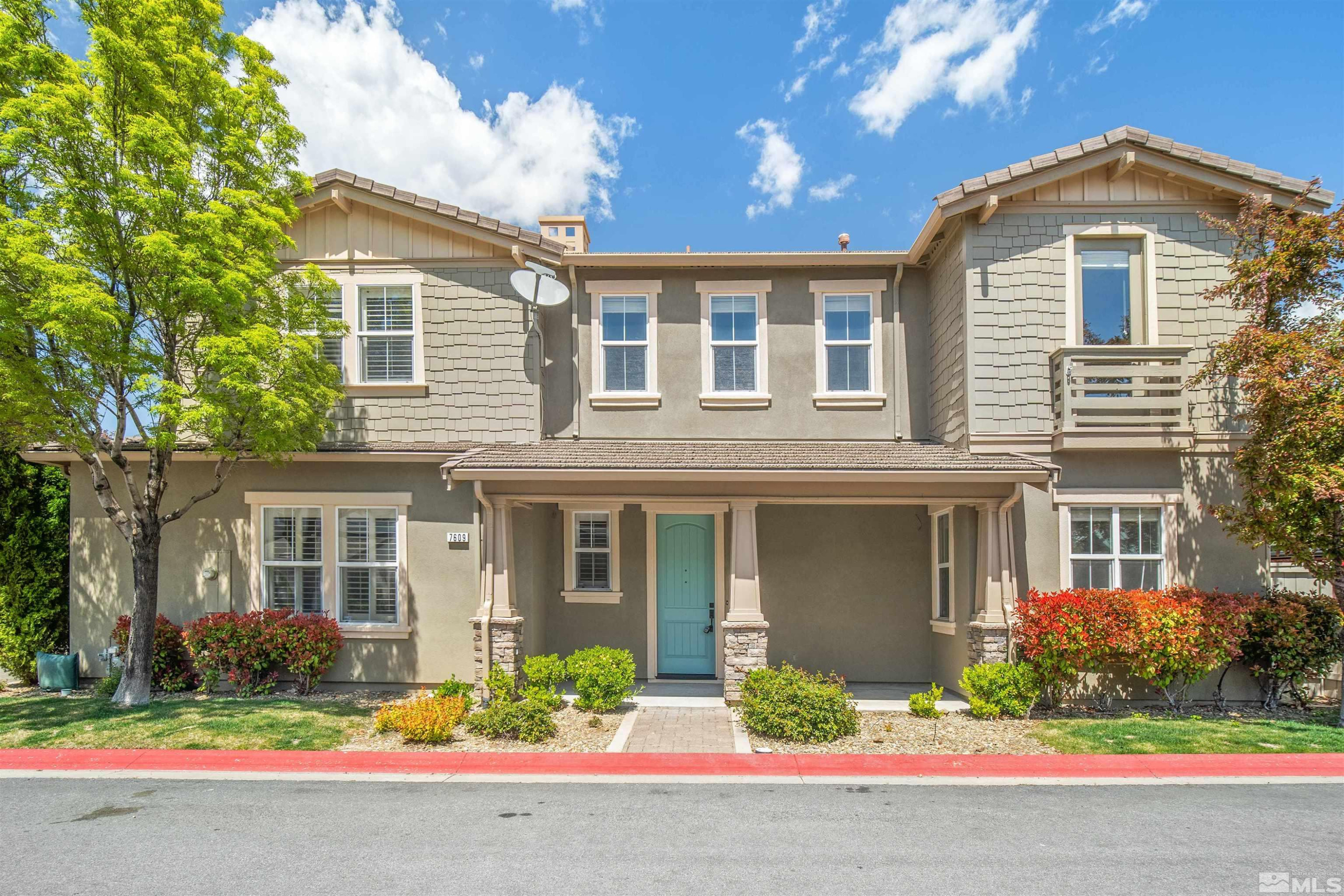 7609 Stone Bluff Way Reno, NV 89523 - Photo 1 of 40 front view of a house with a yard