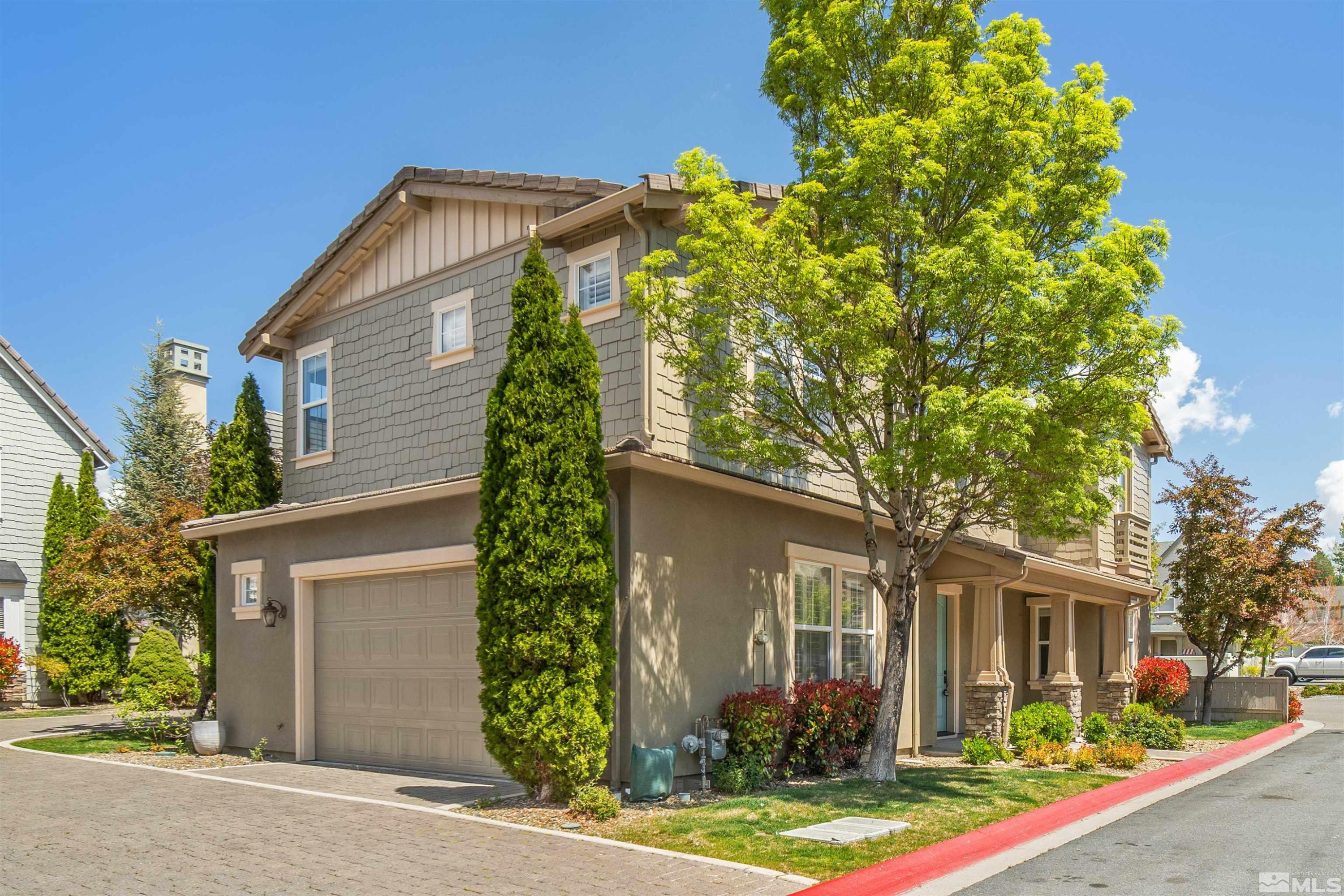 7609 Stone Bluff Way Reno, NV 89523 - Photo 3 of 40 front view of house with a yard and potted plants