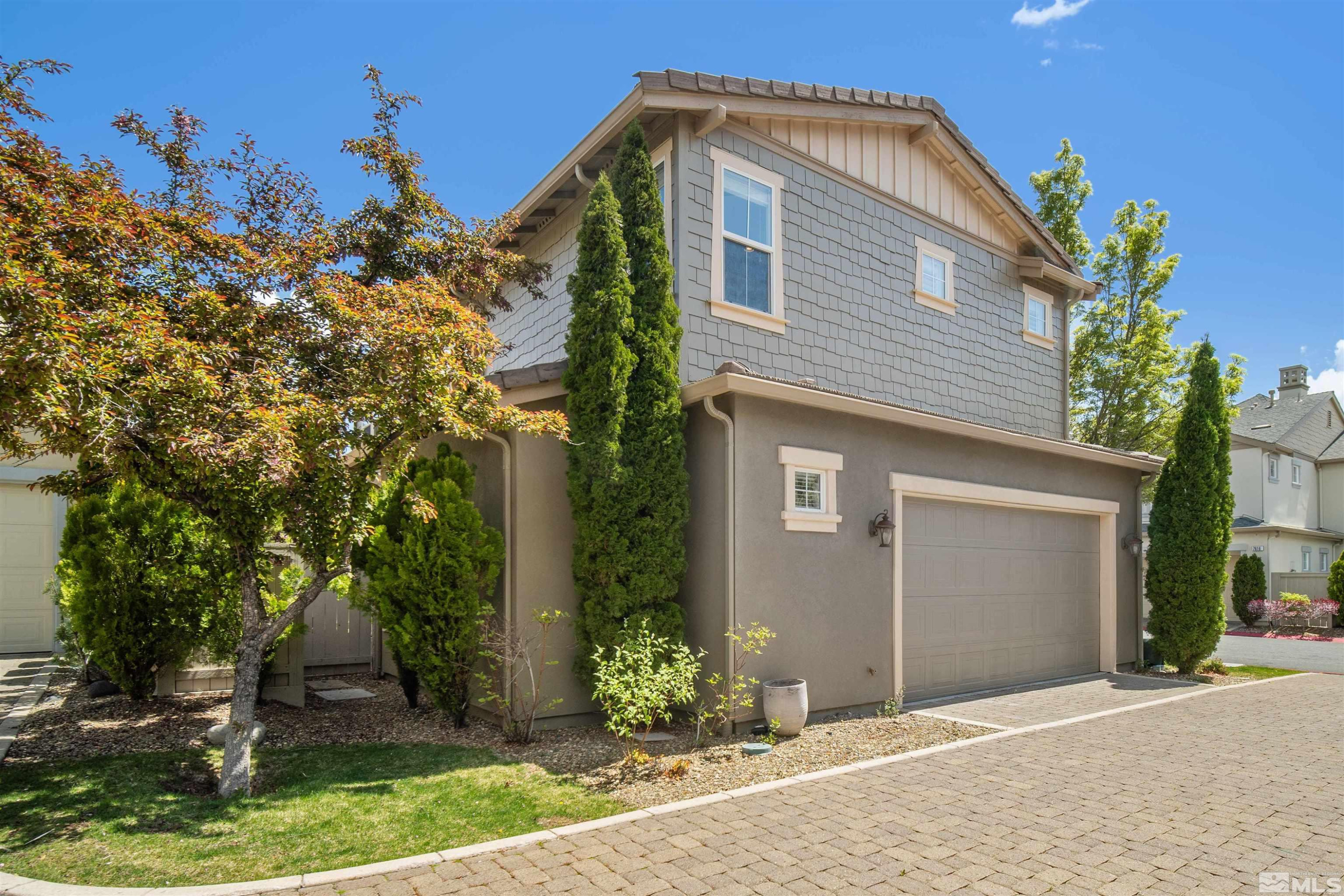 7609 Stone Bluff Way Reno, NV 89523 - Photo 4 of 40 a front view of a house with a yard