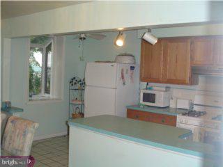 35 Concord Road Darby, PA 19023 - Photo 4 of 6 a kitchen with a refrigerator and a sink