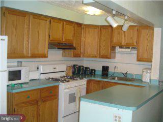 35 Concord Road Darby, PA 19023 - Photo 5 of 6 a kitchen with stainless steel appliances granite countertop a sink stove and cabinets