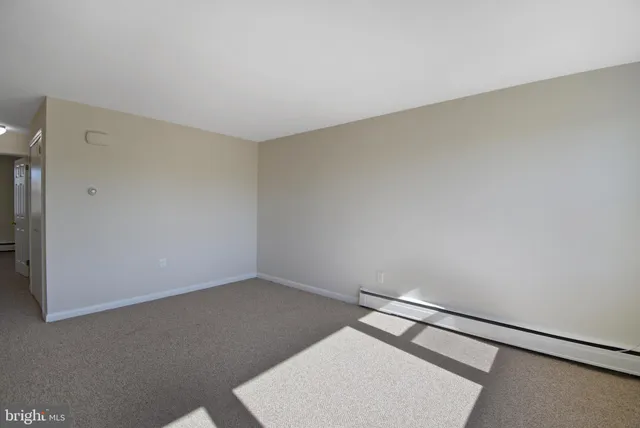 an empty room with a bench