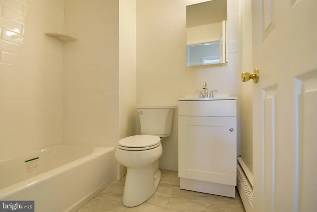 a bathroom with a toilet and a sink