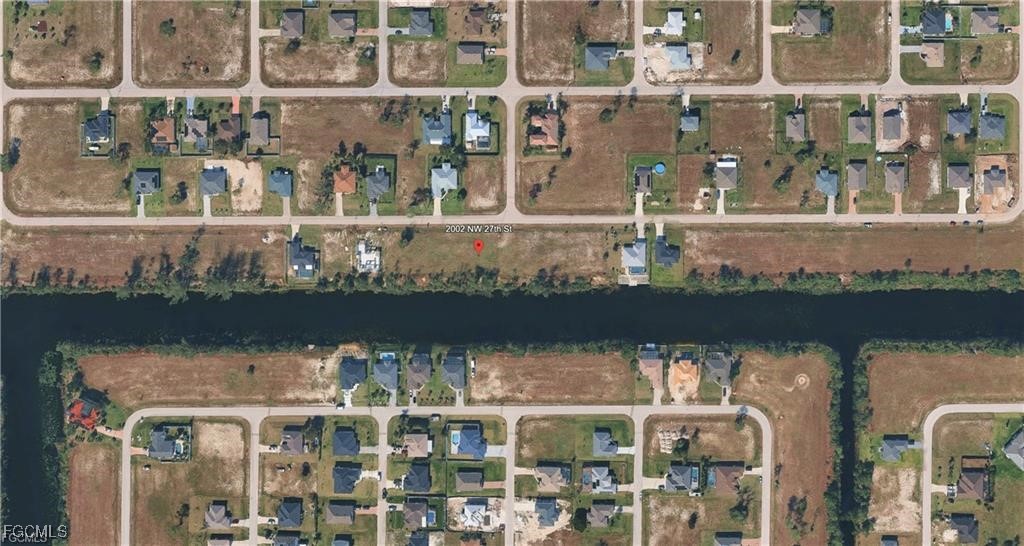 2002 Northwest 27th Street Cape Coral, FL 33993 - Photo 3 of 9 an aerial view of a house