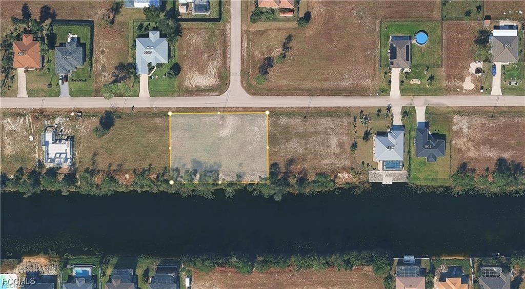 2002 Northwest 27th Street Cape Coral, FL 33993 - Photo 9 of 9 an aerial view of a residential building with outdoor space