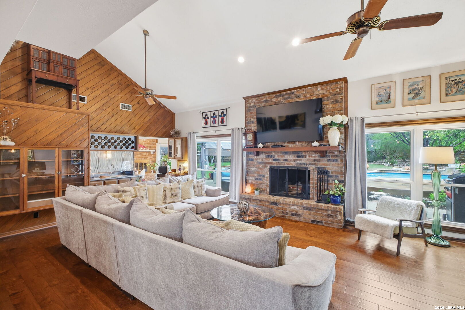 14502 Circle A Trail Helotes, TX 78023 - Photo 11 of 50 a living room with furniture a large window and a fireplace