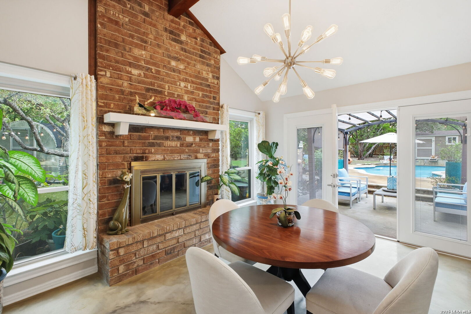 14502 Circle A Trail Helotes, TX 78023 - Photo 13 of 50 a living room with furniture a window and a fireplace
