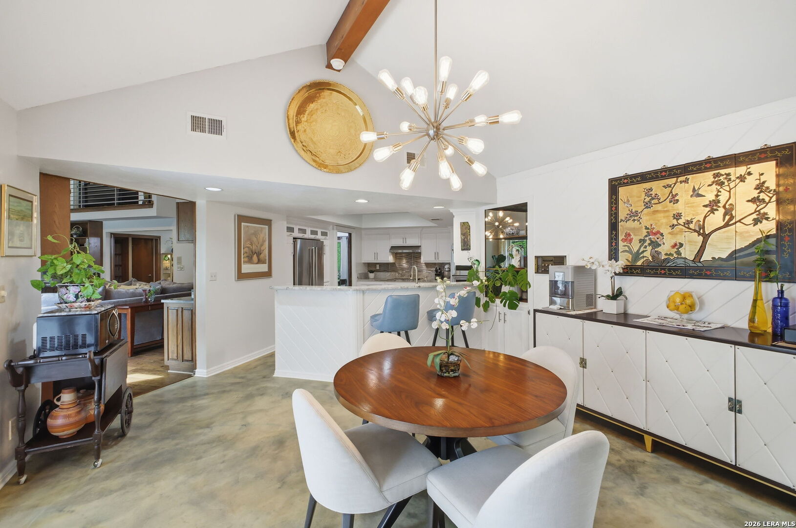 14502 Circle A Trail Helotes, TX 78023 - Photo 15 of 50 a view of a dining room with furniture a kitchen and chandelier