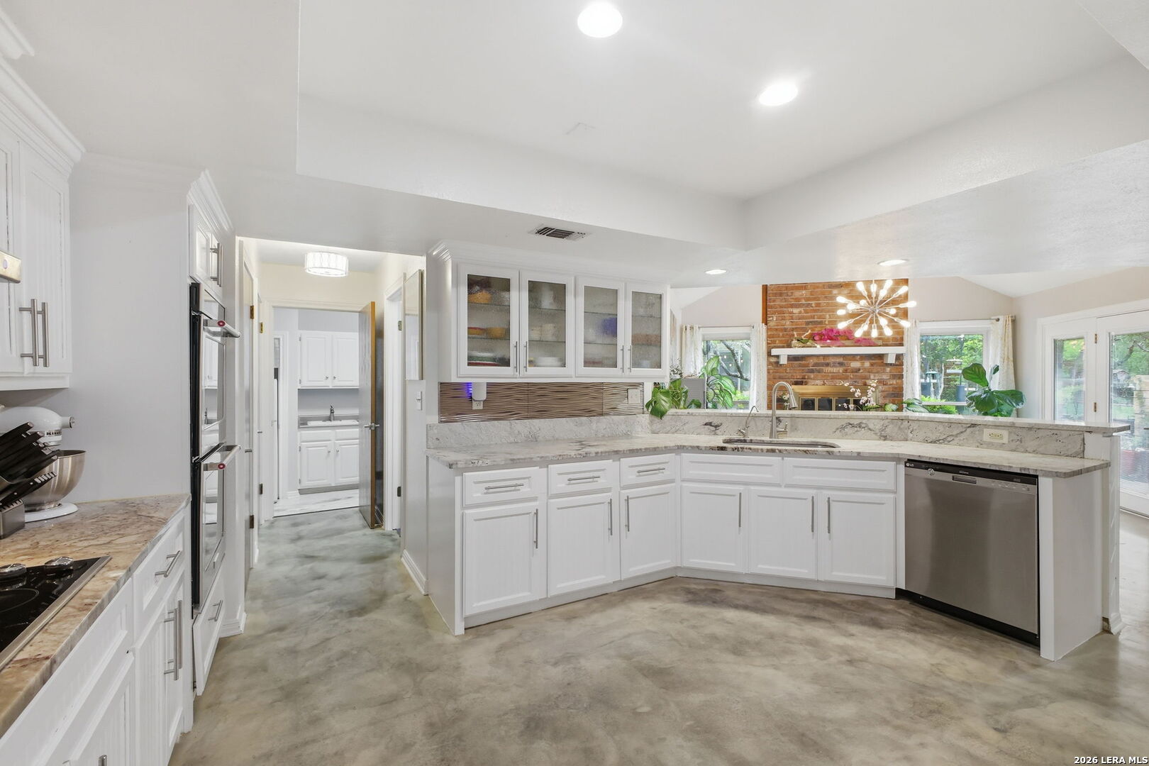 14502 Circle A Trail Helotes, TX 78023 - Photo 19 of 50 a large bathroom with a granite countertop sink and a mirror