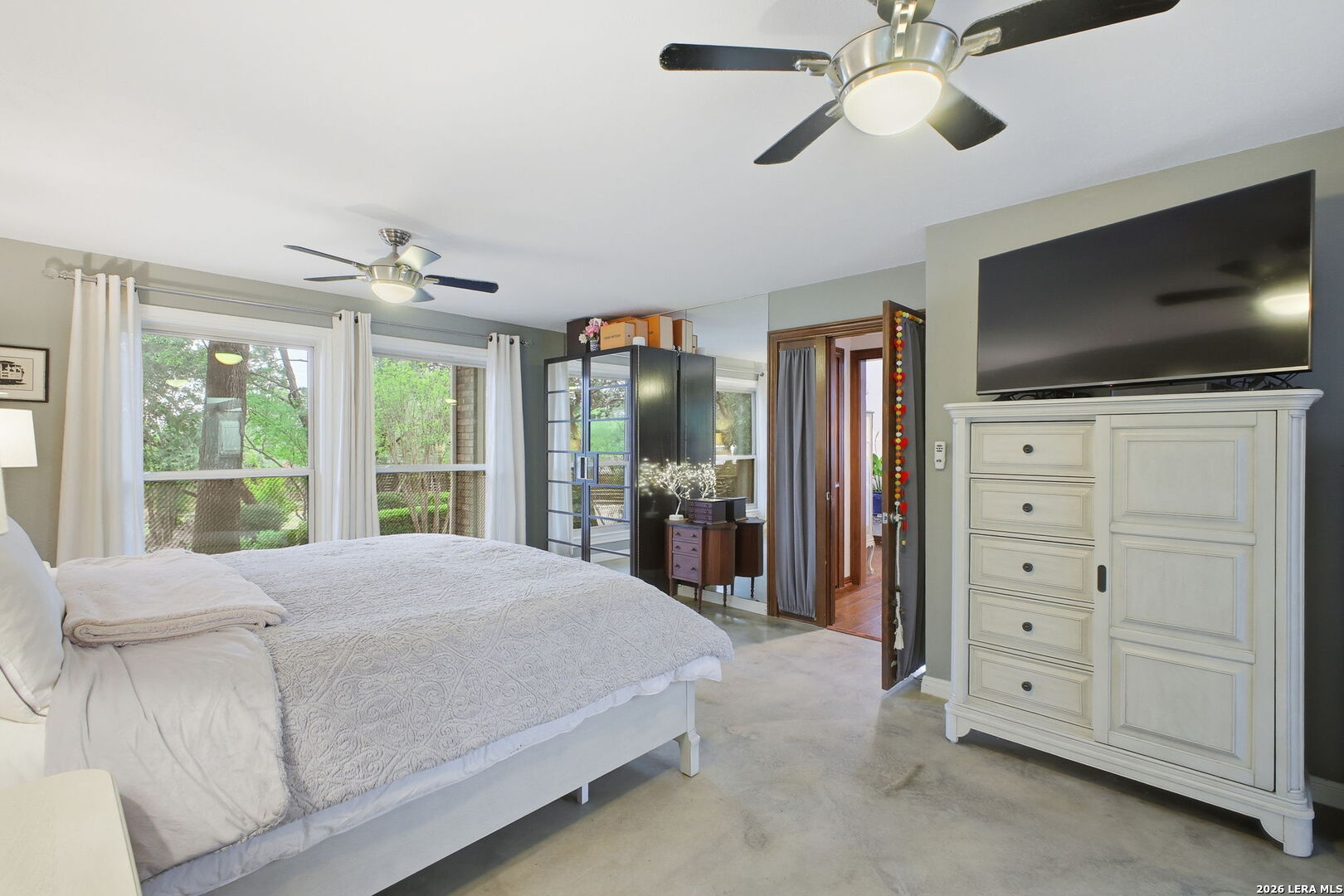 14502 Circle A Trail Helotes, TX 78023 - Photo 27 of 50 a bedroom with a bed and a flat screen tv