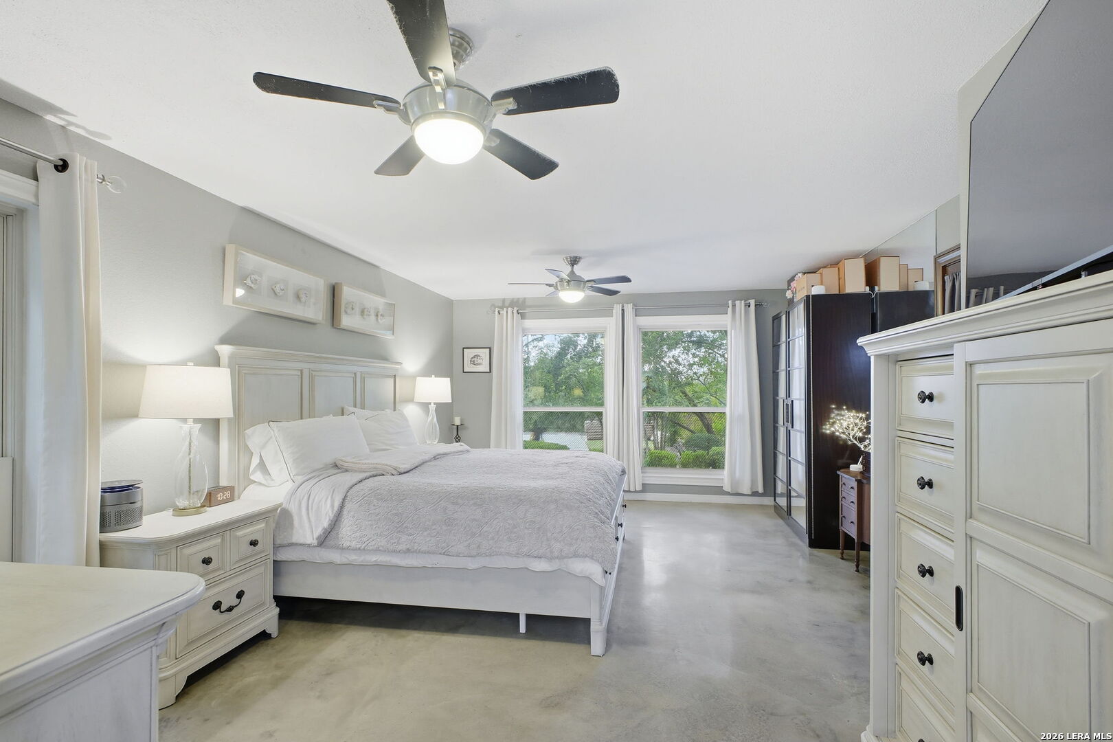 14502 Circle A Trail Helotes, TX 78023 - Photo 28 of 50 a bedroom with a bed and a large window