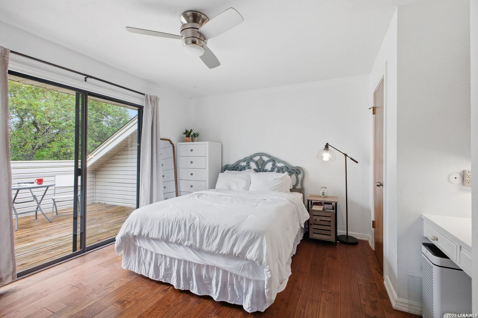 14502 Circle A Trail Helotes, TX 78023 - Photo 31 of 50 a bedroom with a bed and wooden floor