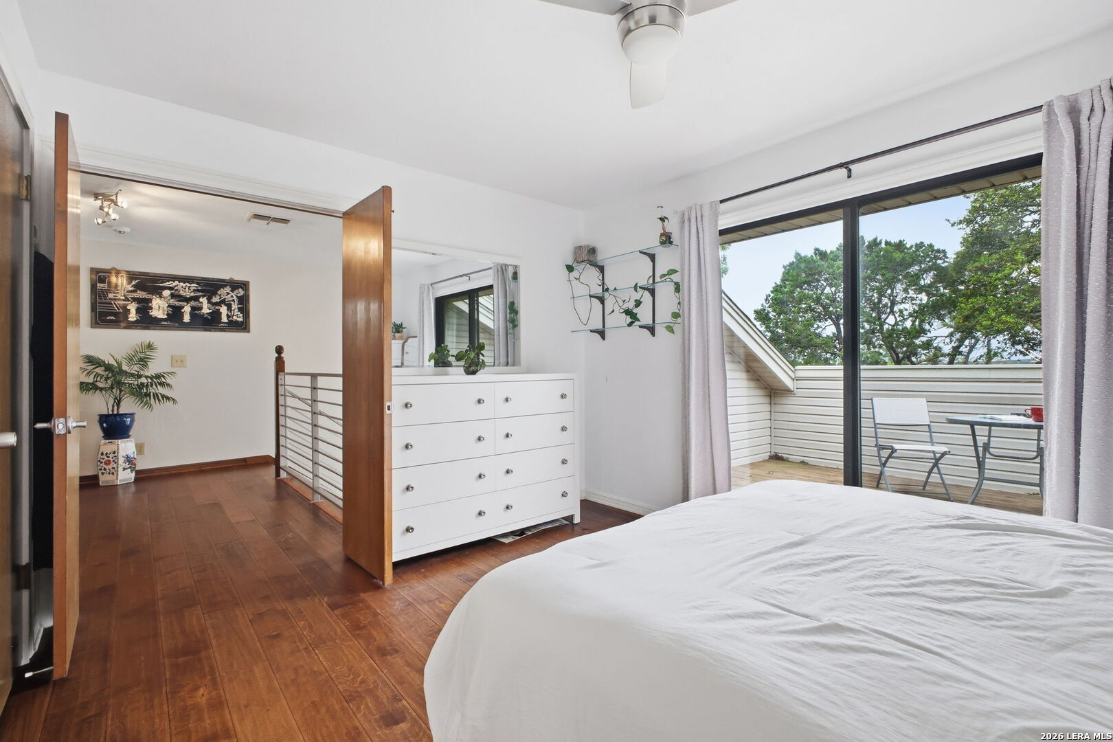 14502 Circle A Trail Helotes, TX 78023 - Photo 33 of 50 a bedroom with a large bed and a dresser
