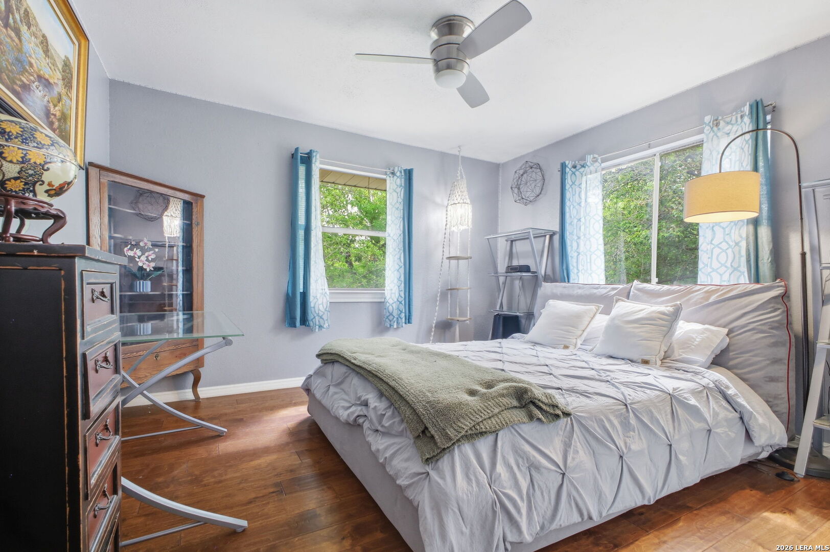 14502 Circle A Trail Helotes, TX 78023 - Photo 35 of 50 a bedroom with a bed wooden floor and window