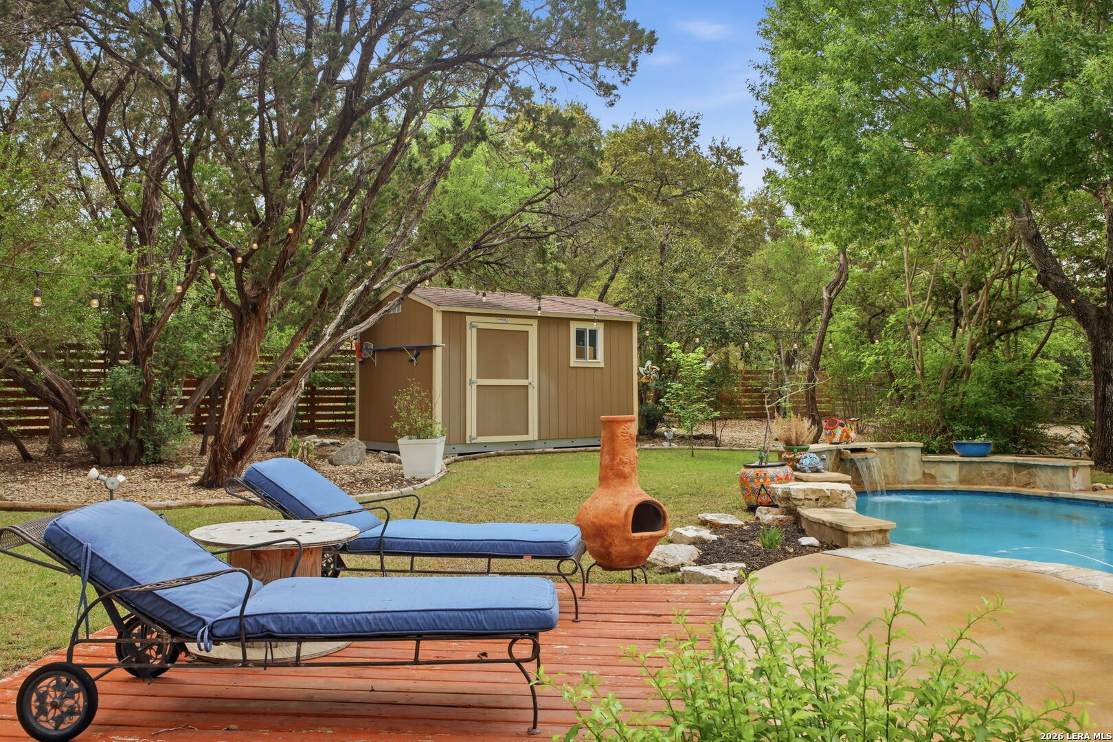 14502 Circle A Trail Helotes, TX 78023 - Photo 40 of 50 a view of backyard with swimming pool and seating space
