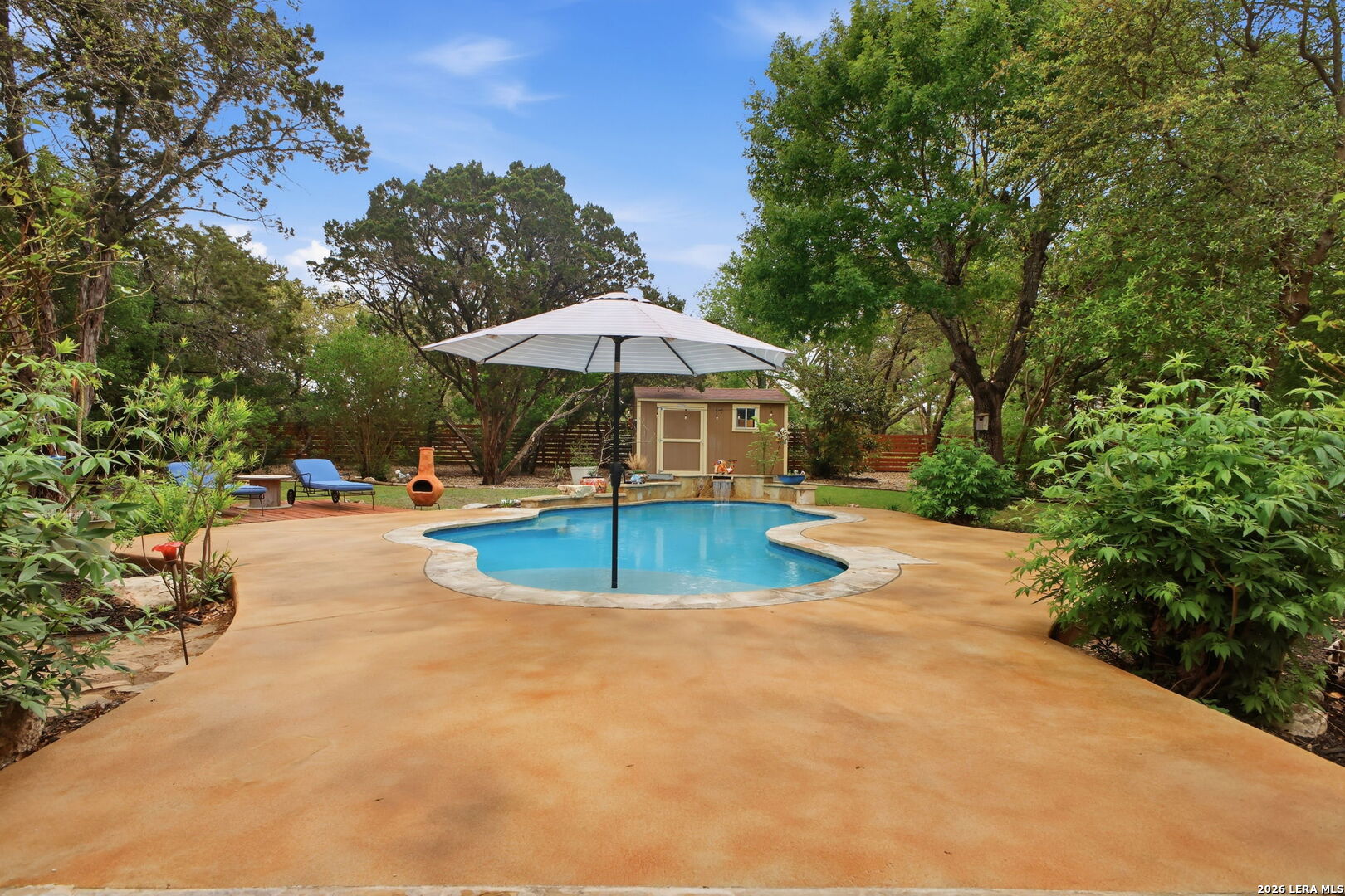 14502 Circle A Trail Helotes, TX 78023 - Photo 41 of 50 a view of a swimming pool with an outdoor space and seating area