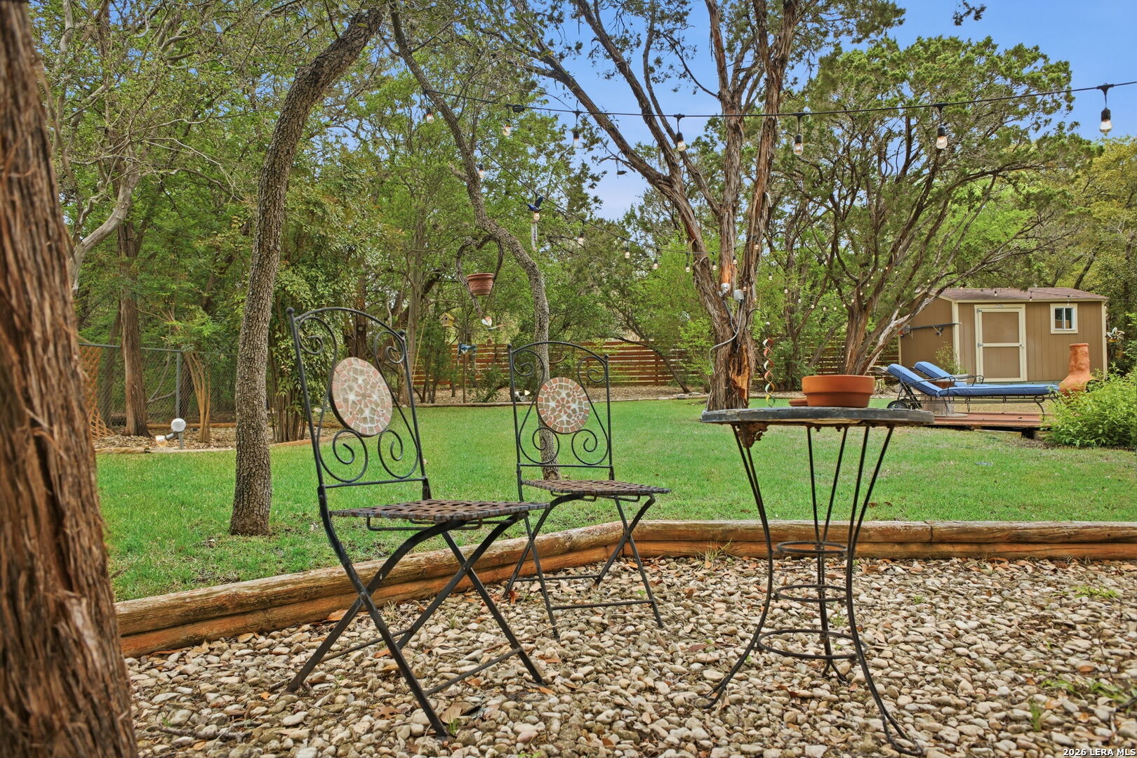 14502 Circle A Trail Helotes, TX 78023 - Photo 45 of 50 a view of a two chairs in a backyard