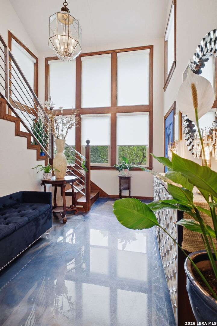 14502 Circle A Trail Helotes, TX 78023 - Photo 5 of 50 a living room with furniture a chandelier and a large window
