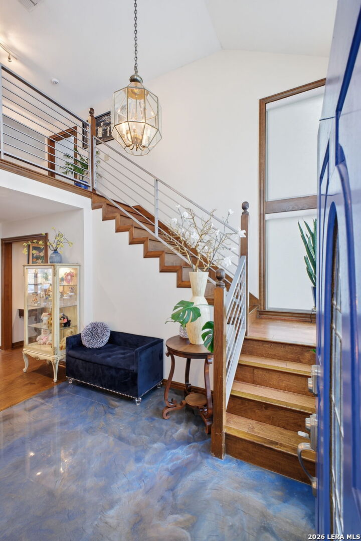 14502 Circle A Trail Helotes, TX 78023 - Photo 6 of 50 a living room with furniture and a chandelier
