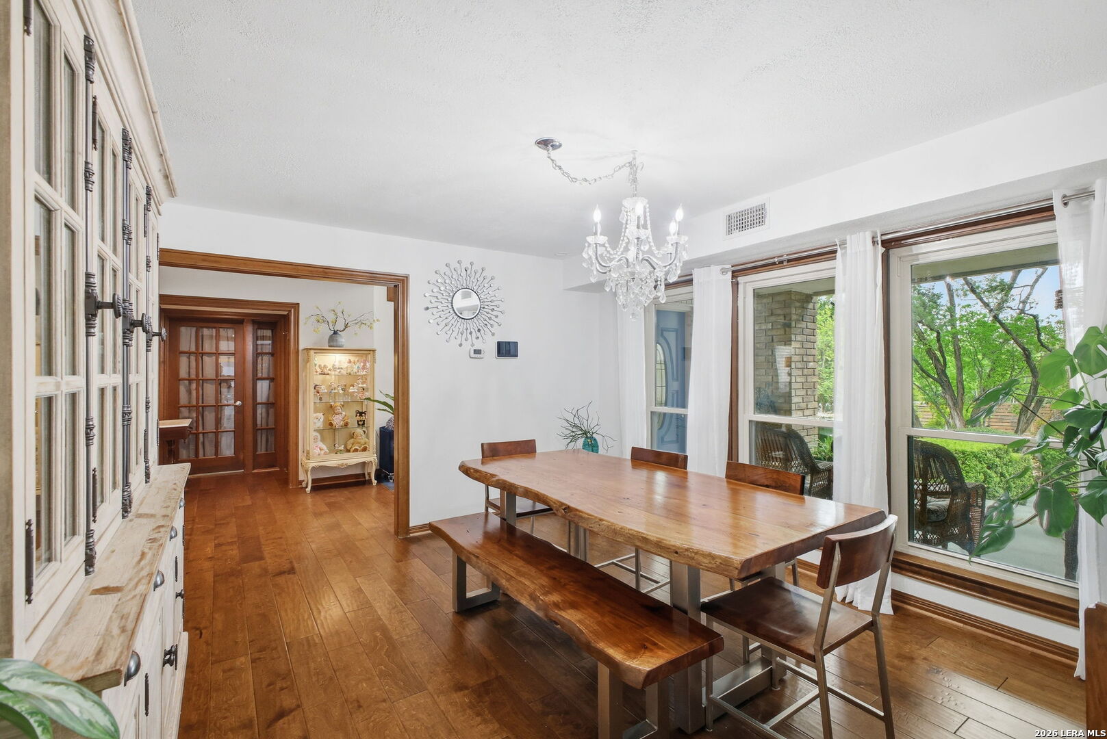 14502 Circle A Trail Helotes, TX 78023 - Photo 9 of 50 a dining room with furniture a chandelier and wooden floor