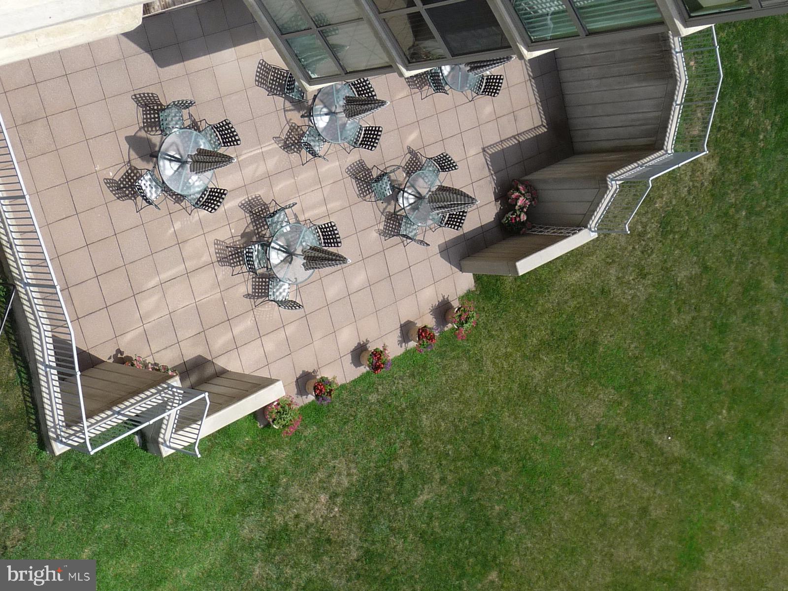 19385 Cypress Ridge Terrace, Unit 722 Leesburg, VA 20176 - Photo 9 of 10 a view of a backyard with chairs