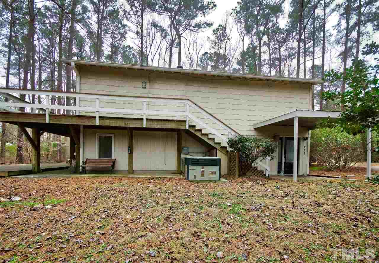 721 Locust Lane Raleigh, NC 27603 - Photo 19 of 22 a front view of a house with a garden