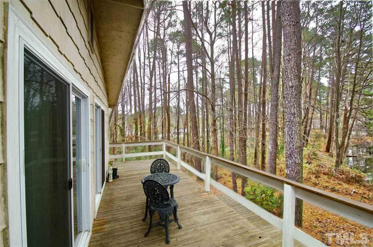 721 Locust Lane Raleigh, NC 27603 - Photo 20 of 22 a view of balcony with wooden floor and outdoor seating