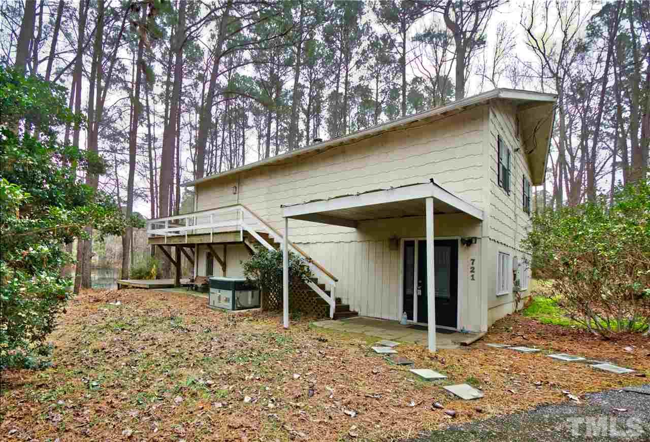 721 Locust Lane Raleigh, NC 27603 - Photo 3 of 22 a view of a house with a yard