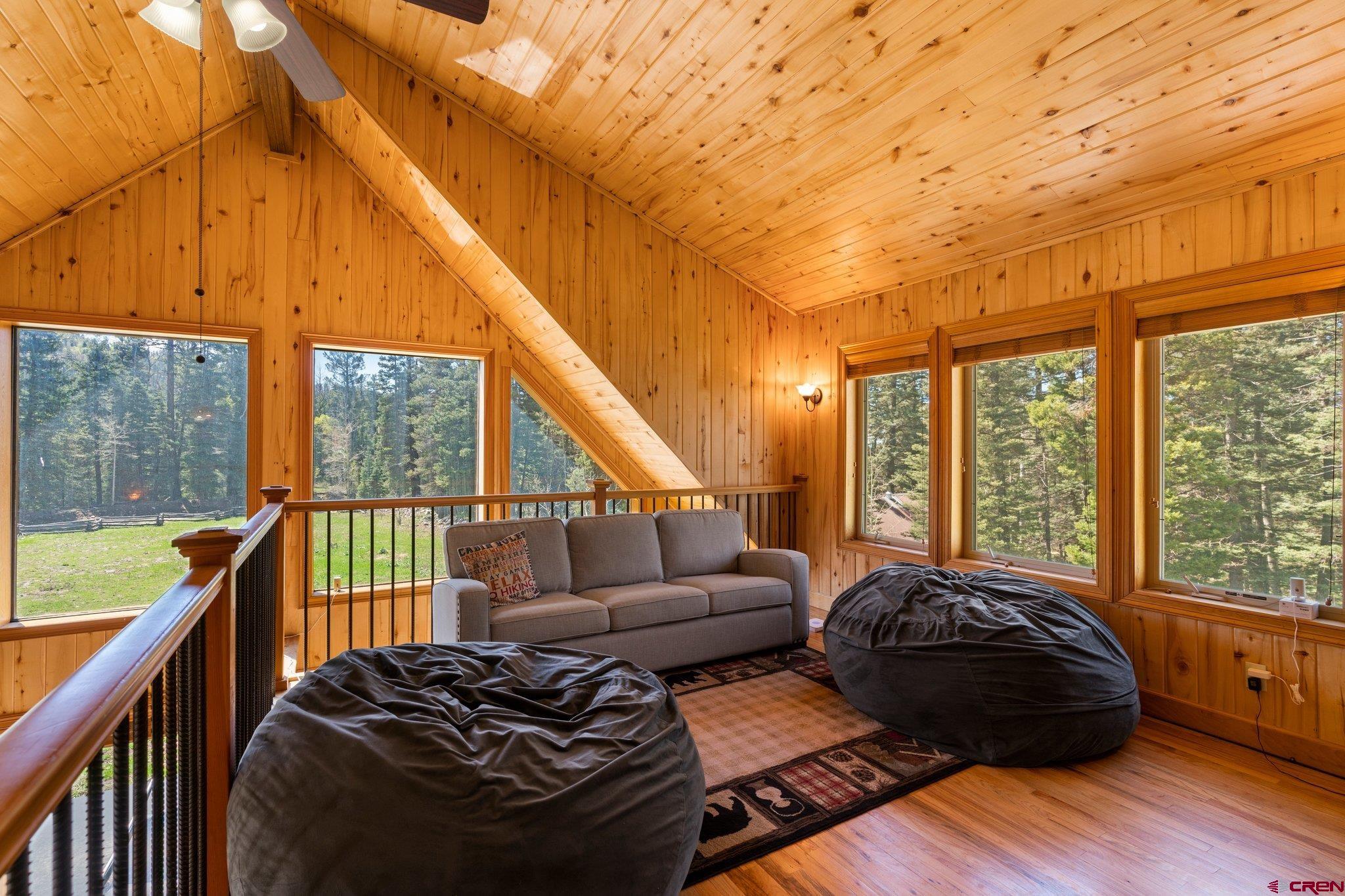 29 Eckart Lane Durango, CO 81301 - Photo 23 of 34 a living room with furniture and a floor to ceiling window