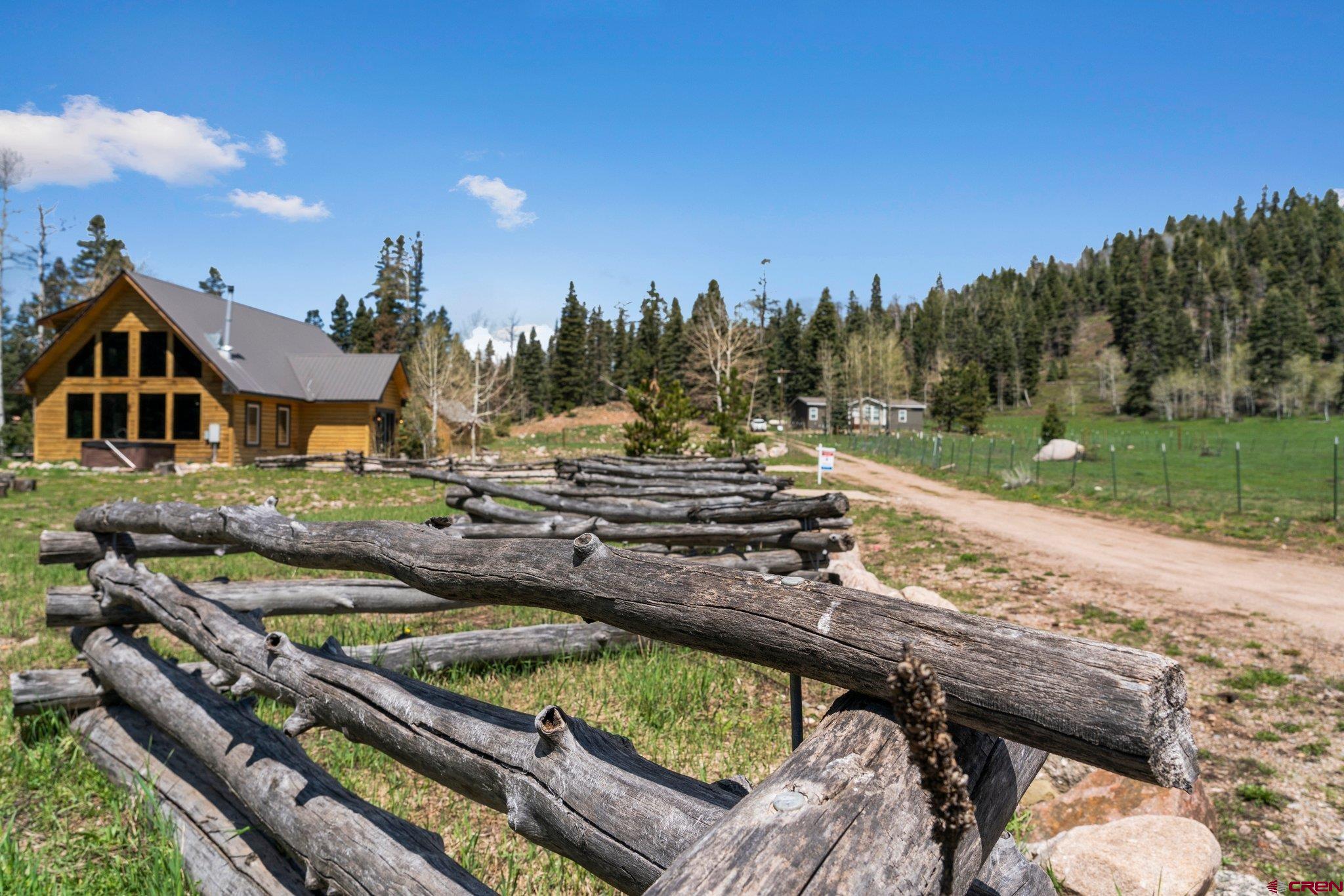 29 Eckart Lane Durango, CO 81301 - Photo 27 of 34 a view of a house with pool and trees in the background
