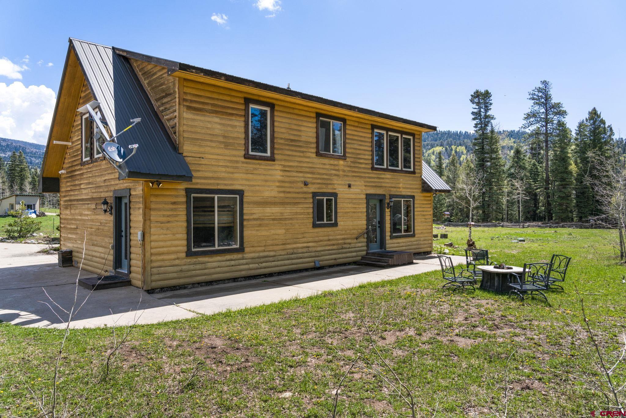 29 Eckart Lane Durango, CO 81301 - Photo 33 of 34 a front view of a house with a yard