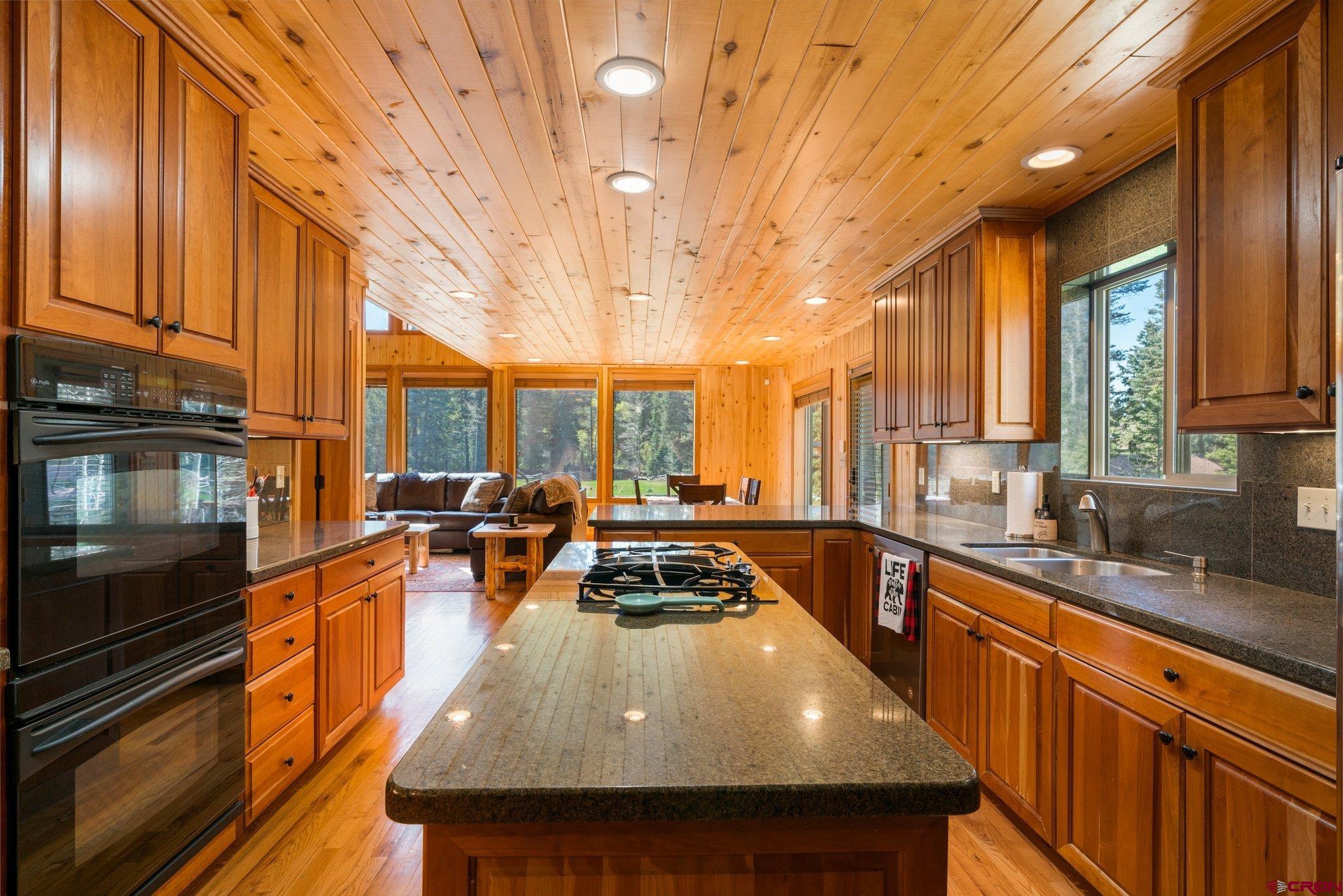 29 Eckart Lane Durango, CO 81301 - Photo 8 of 34 a kitchen with stainless steel appliances a stove a sink a microwave and cabinets