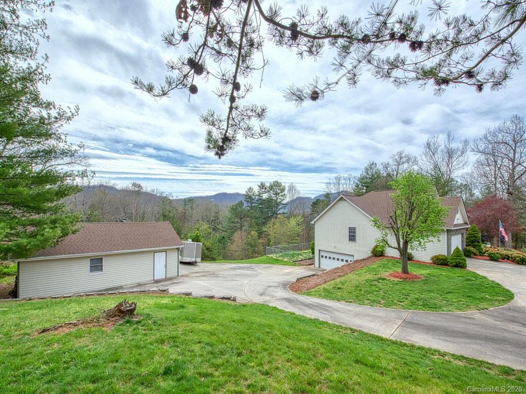 208 Oak Ridge Drive Clyde, NC 28721 - Photo 3 of 36 a view of a house with a yard