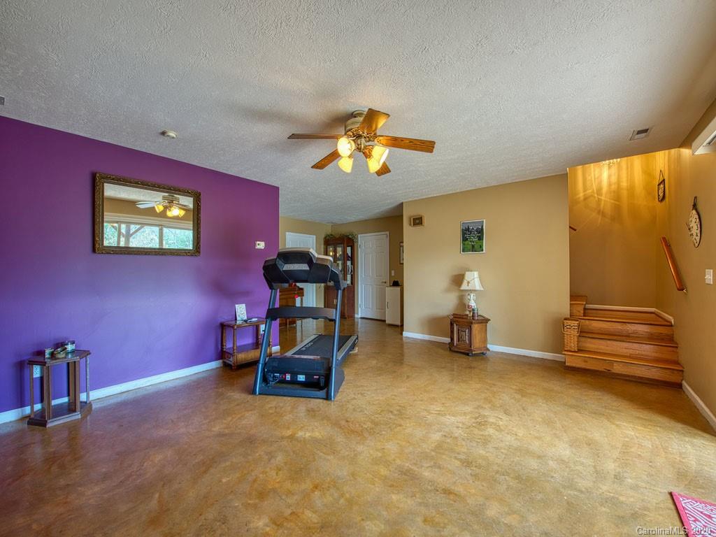 208 Oak Ridge Drive Clyde, NC 28721 - Photo 30 of 36 a view of a room with gym equipment