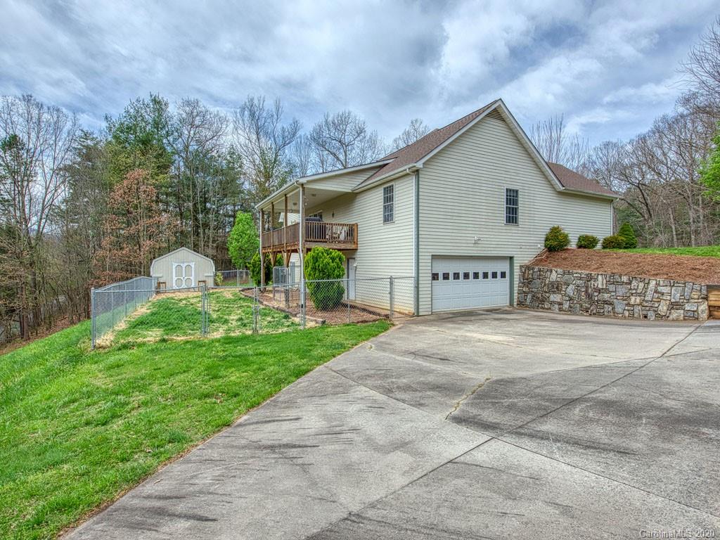 208 Oak Ridge Drive Clyde, NC 28721 - Photo 4 of 36 a view of a house with a yard and large tree