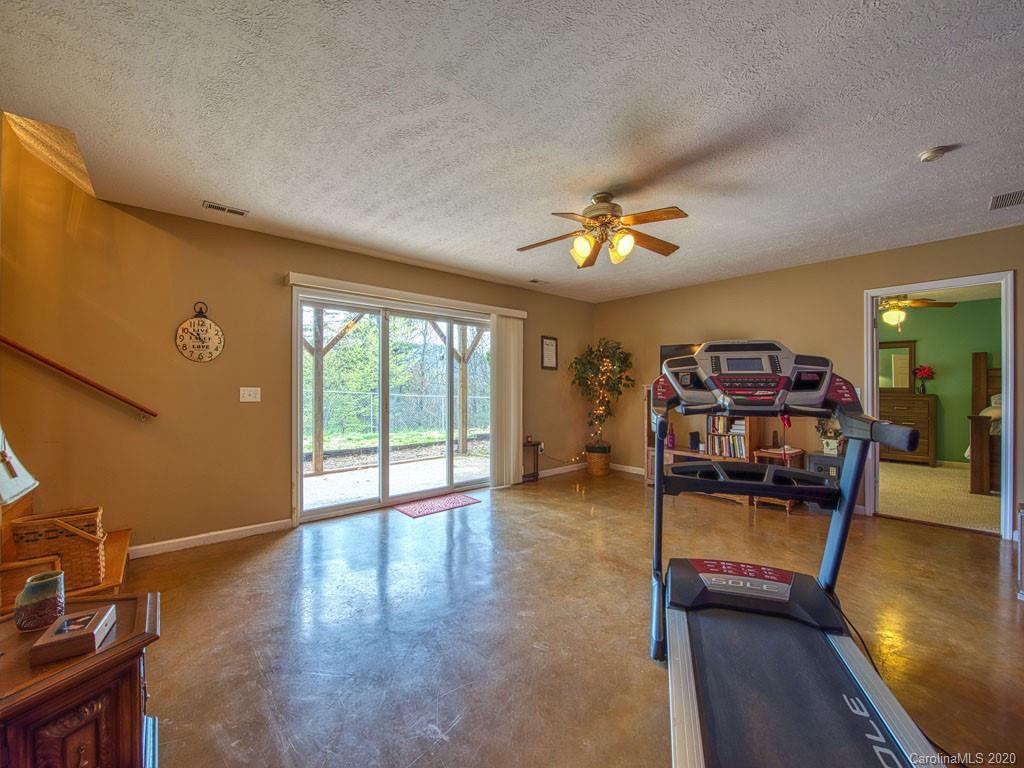 208 Oak Ridge Drive Clyde, NC 28721 - Photo 32 of 36 a view of a livingroom with furniture workspace and a window