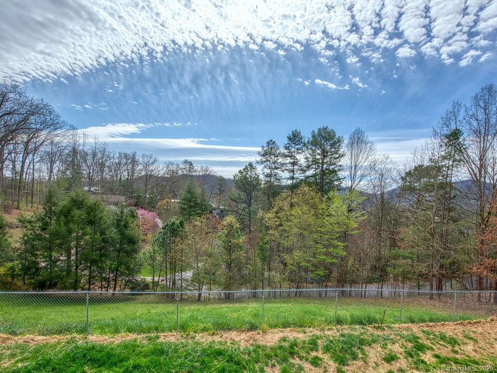 208 Oak Ridge Drive Clyde, NC 28721 - Photo 8 of 36 a view of a golf course with a garden