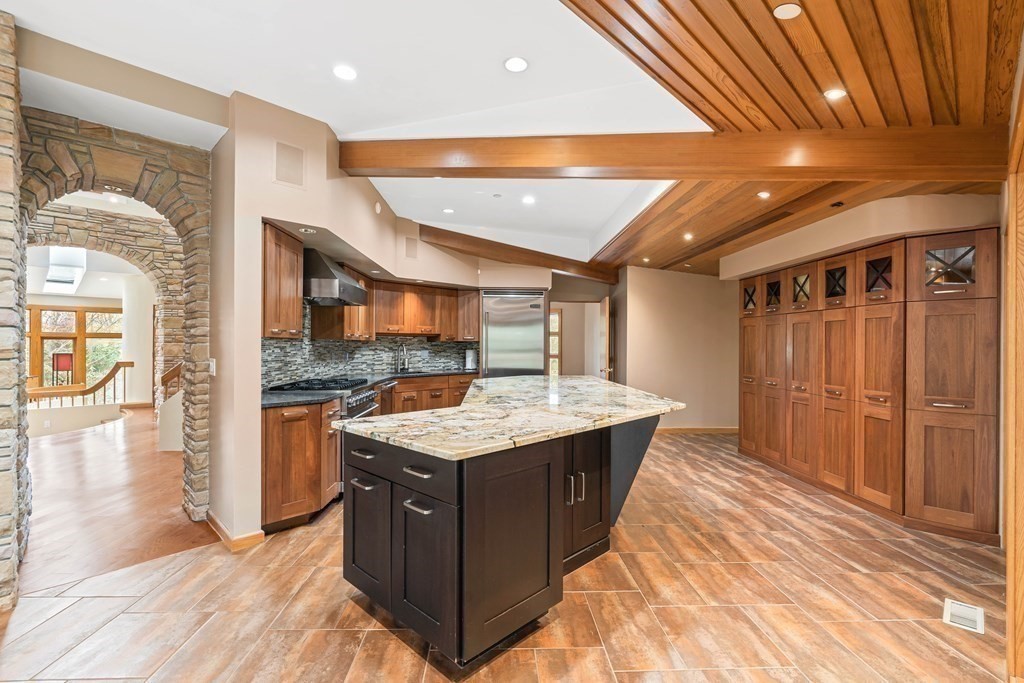 44 Sears Road Southborough, MA 01772 - Photo 11 of 41 a kitchen with a stove and a wooden cabinets