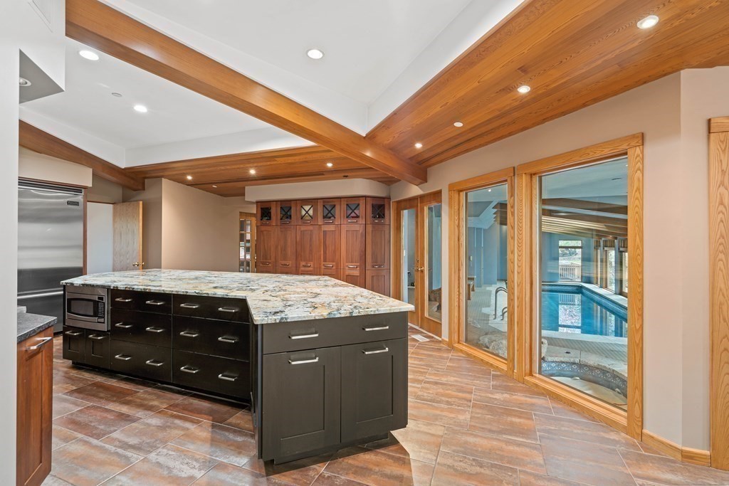 44 Sears Road Southborough, MA 01772 - Photo 12 of 41 a kitchen with a stove and a cabinet