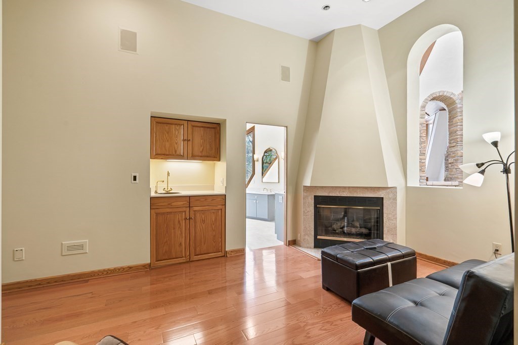 44 Sears Road Southborough, MA 01772 - Photo 23 of 41 a living room with furniture and a fireplace