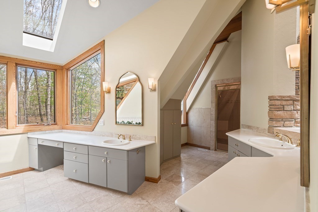 44 Sears Road Southborough, MA 01772 - Photo 28 of 41 a bathroom with a tub sink and mirror