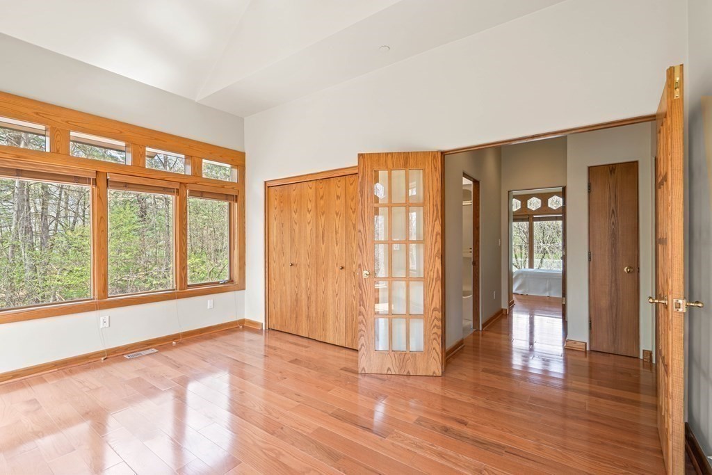 44 Sears Road Southborough, MA 01772 - Photo 33 of 41 a view of an empty room with wooden floor and a window