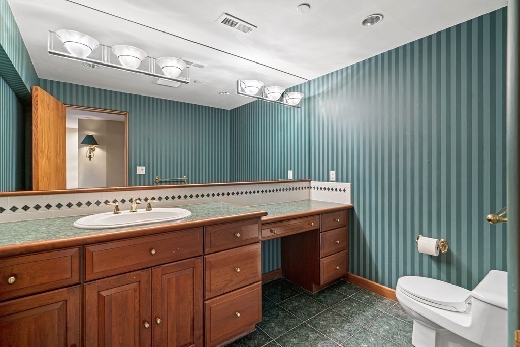 44 Sears Road Southborough, MA 01772 - Photo 36 of 41 a bathroom with a double vanity sink mirror and toilet