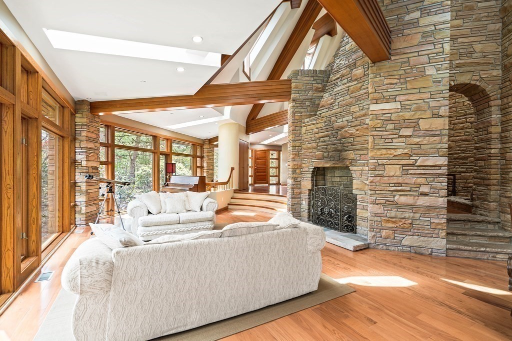 44 Sears Road Southborough, MA 01772 - Photo 8 of 41 a living room with fireplace furniture and a floor to ceiling window