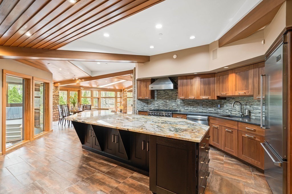 44 Sears Road Southborough, MA 01772 - Photo 10 of 41 a kitchen with a sink stove and cabinets