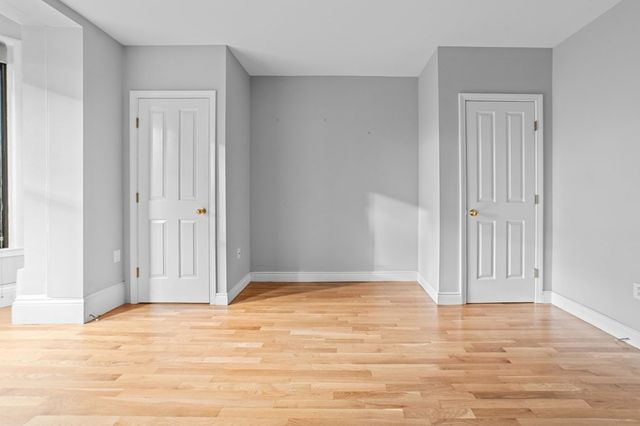 a view of wooden floor in an empty room