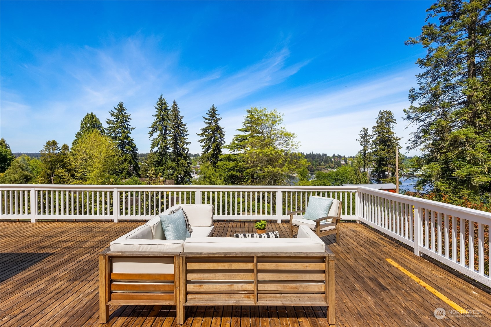 6024 Rose Loop Northeast Bainbridge Island, WA 98110 - Photo 21 of 40 a view of a wooden deck with a bench