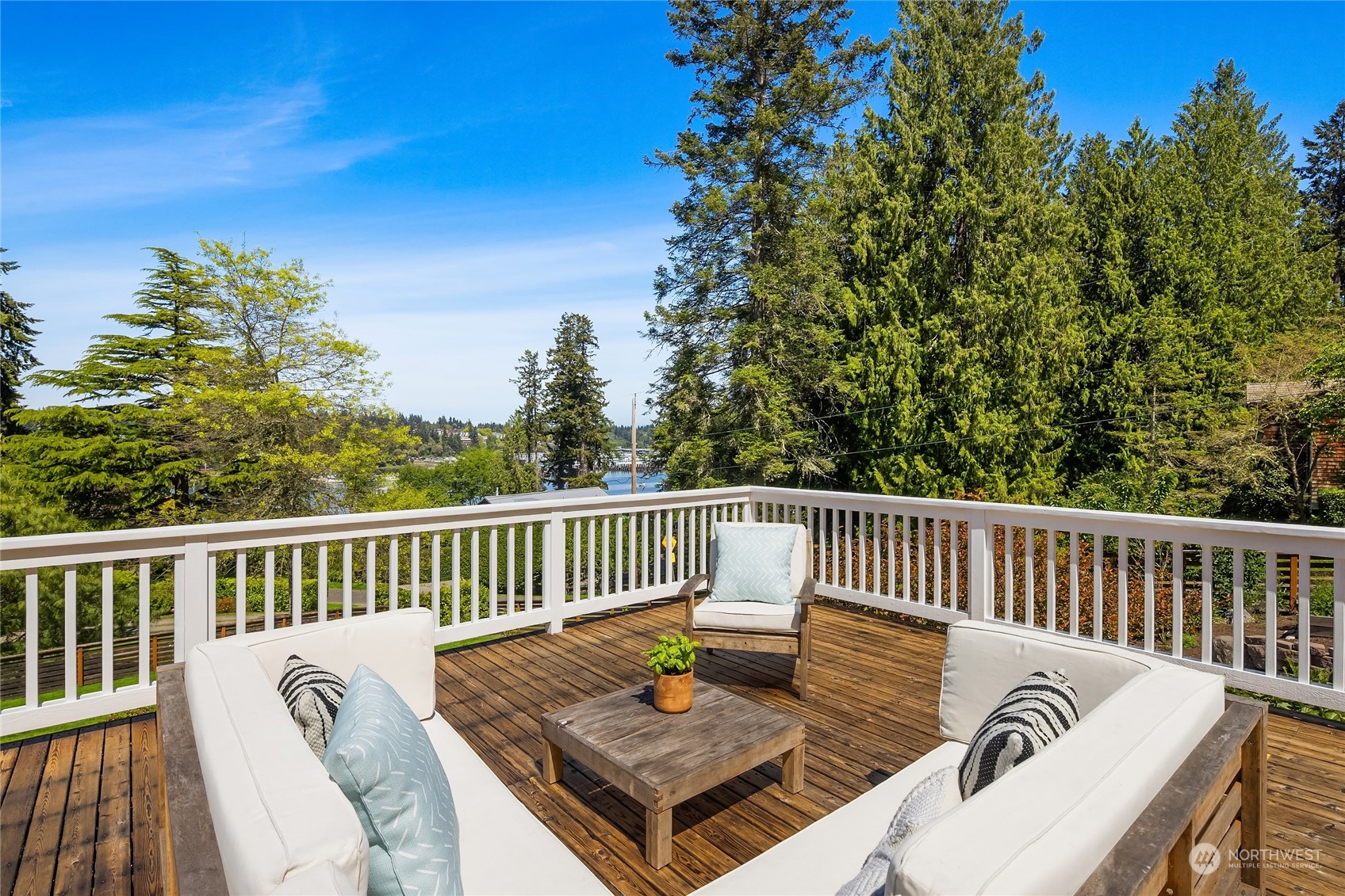 6024 Rose Loop Northeast Bainbridge Island, WA 98110 - Photo 22 of 40 a view of a chair in wooden deck